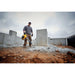 DEWALT DCBL770X1 cordless blower clearing outdoor jobsite debris