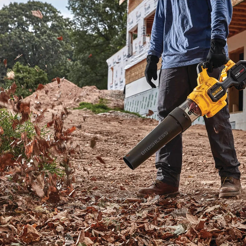 DEWALT DCBL772X1 cordless blower clearing leaves outdoors
