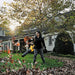 DEWALT DCBL772X1 cordless blower clearing fallen leaves in a yard