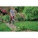 Operator using Einhell 3433556 cordless leaf blower on garden path, battery sold separately