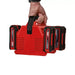 Einhell four-port charger carried by its handle with four batteries installed
