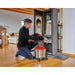 Einhell cordless ash vacuum cleaning ash from a fireplace in a commercial setting