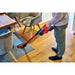 Einhell cordless stick vacuum cleaning hard floors in a commercial workspace