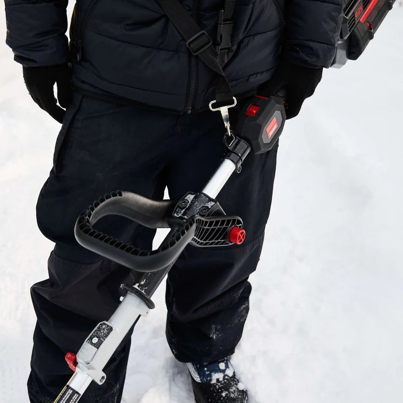 Operator using the support loop on a Garant 85805 cordless snow shovel