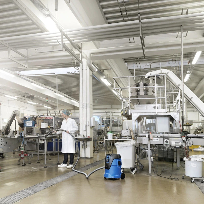 Nilfisk AERO 26 professional wet and dry vacuum cleaning a commercial facility floor