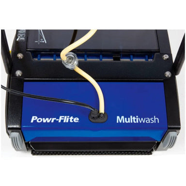 commercial scrubber cleaning tile and grout floors with cylindrical brushes