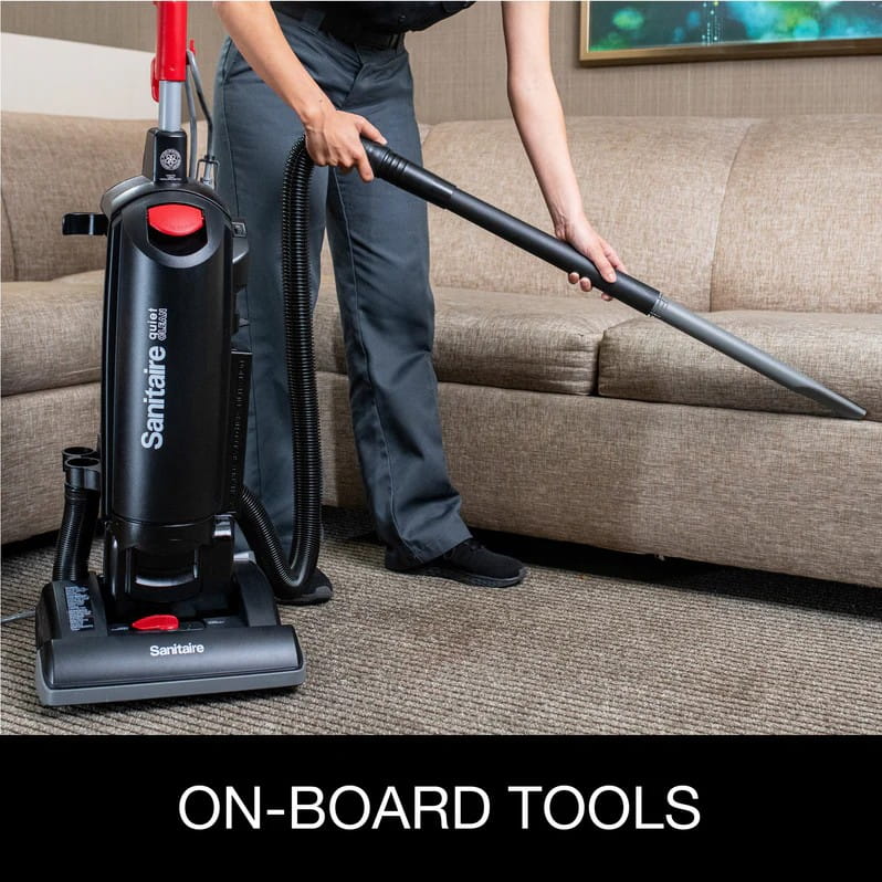 Onboard cleaning tools stored on Sanitaire QuietClean commercial upright vacuum